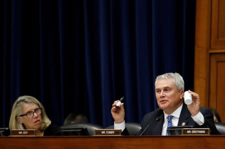 Rep. James Comer (R-KY) holds up CBD containers used for personal consumption, during the testimony of Anne Schuchat, principal deputy secretary of the Centers for Disease Control and Prevention in Washington