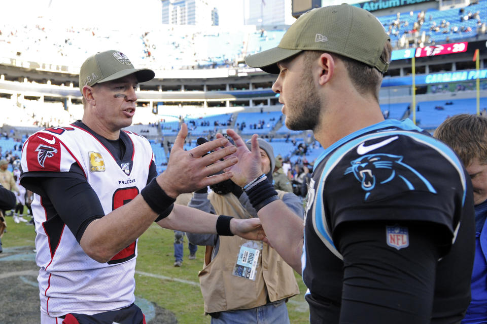 Atlanta Falcons quarterback Matt Ryan (2) and Carolina Panthers quarterback Kyle Allen, right, speak following an NFL football game in Charlotte, N.C., Sunday, Nov. 17, 2019. The Falcons won 29-3. (AP Photo/Mike McCarn)