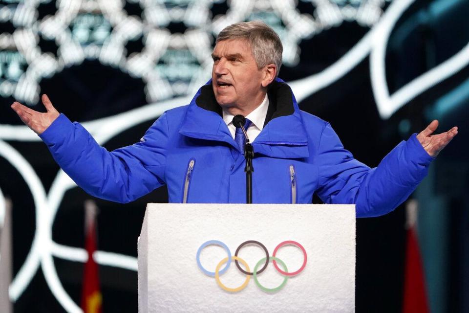 President of the International Olympic Committee Thomas Bach address the crowd during the opening ceremony of the 2022 Winter Olympics, Friday, Feb. 4, 2022, in Beijing. (AP Photo/Jae C. Hong)