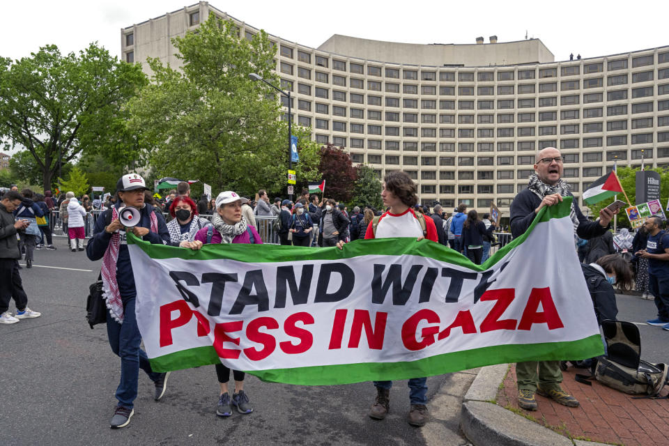Demonstrators protest the Israel-Hamas war outside the Washington Hilton hote (Kevin Wolf / AP)