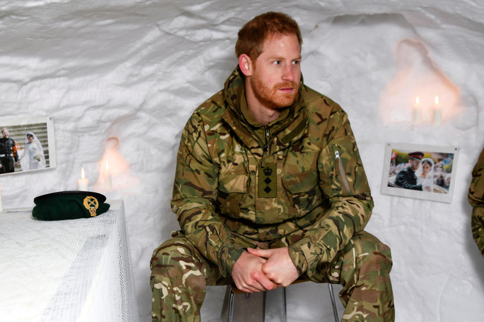 Britain's Prince Harry, Captain General Royal Marines, sits in a snow cave decorated with candles and his wedding photos, during Exercise Clockwork, celebrating 50 years of cold weather military training at Bardufoss Air Station, Norway February 14, 2019. NTB Scanpix/Rune Stoltz Bertinussen via REUTERS ATTENTION EDITORS - THIS IMAGE WAS PROVIDED BY A THIRD PARTY. NORWAY OUT