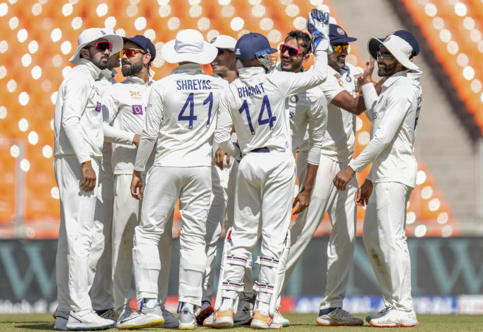 Indian players celebrate dismissal of Australia's Usman Khawaja during the second day of the fourth cricket test match between India and Australia in Ahmedabad, India, Friday, March 10, 2023. (AP Photo/Ajit Solanki)