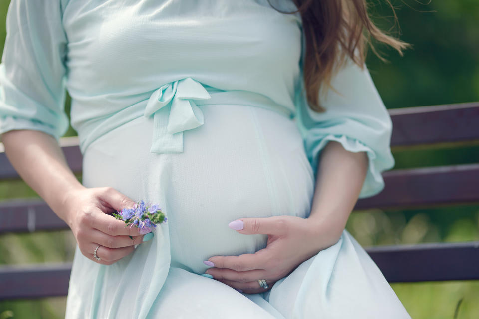 Pregnant bridesmaid