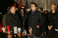 Albin Kurti, center, leader of Self-Determination Movement (Vetevendosje), addresses a celebrating crowd gathered after winning the parliamentary elections in Kosovo capital Pristina early Monday, Oct. 7, 2019. Two Kosovo opposition parties emerged as the top-vote getters in Sunday's snap election of a new parliament held amid calls for leaders to resume dialogue with Serbia over normalizing ties. Self-Determination supporters took to the streets to celebrate. (AP Photo/Visar Kryeziu)