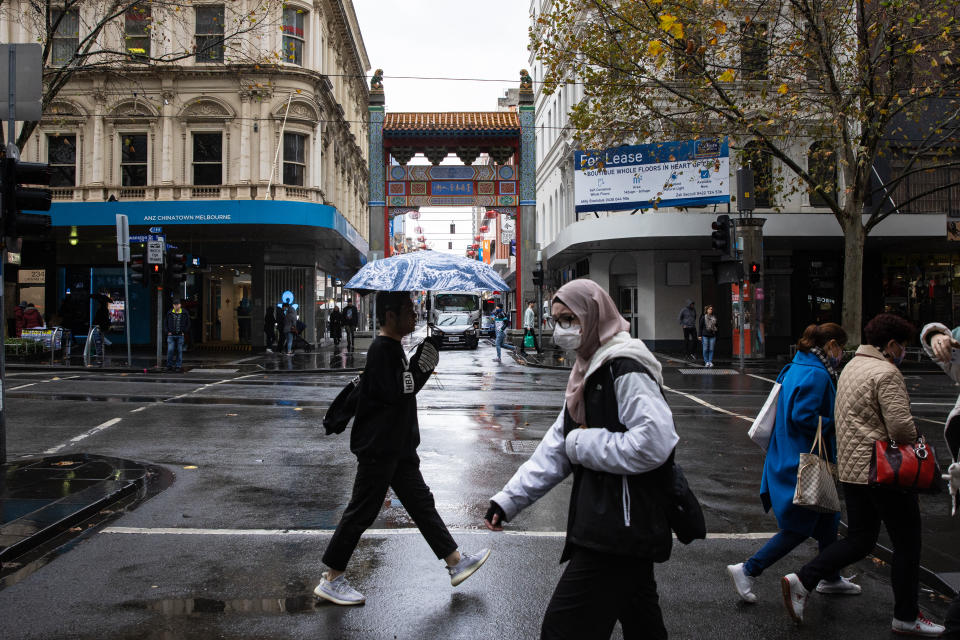 People walk along Swanston Street in Melbourne, Monday, June 6, 2022.