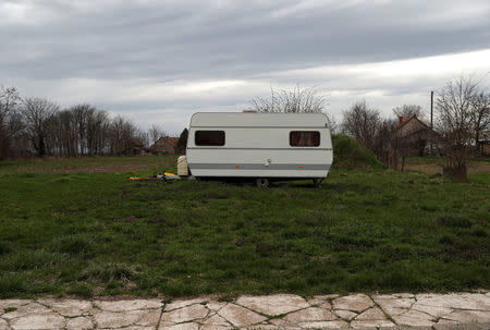 A caravan stands in an empty field in the village of Bacsszentgyorgy, Hungary, March 31, 2018. REUTERS/Bernadett Szabo