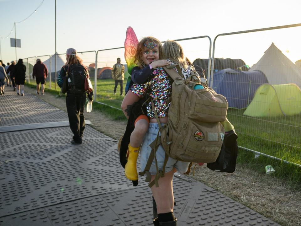 A young girl is carried out of Glastonbury Festival in 2022 (Getty Images)