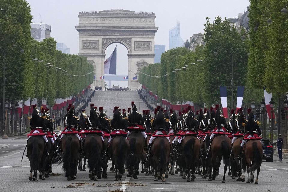 Republican Guards ride up the Champs-Elysees avenue during ceremonies marking the 79th anniversary of Victory Day, Wednesday, May 8, 2024 in Paris. (AP Photo/Michel Euler, Pool)