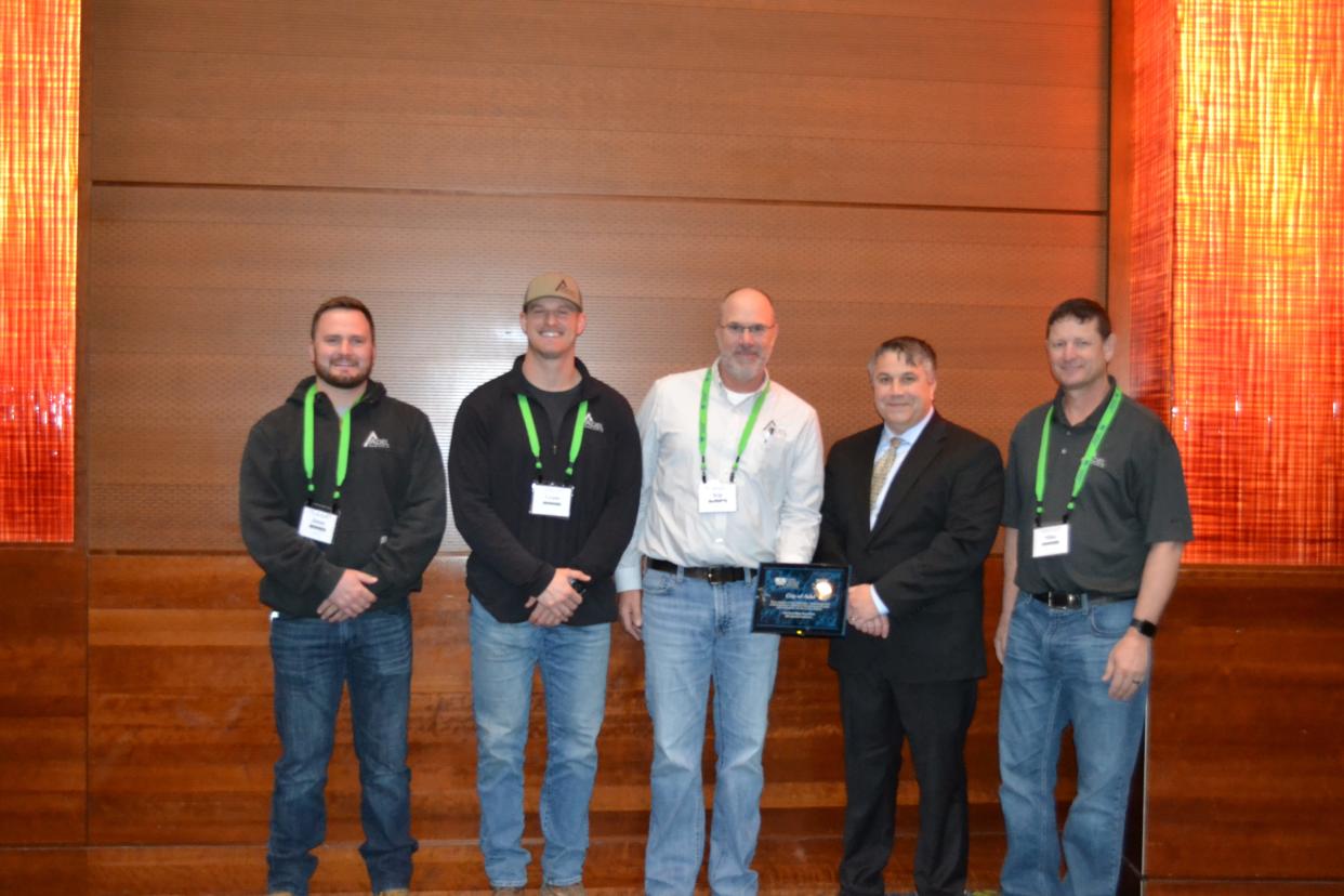 City of Adel representative Kip Overton is presented with Iowa Rural Water’s 2022 Community of the Year Award during the association's annual conference held on Feb. 20-22 in Des Moines.