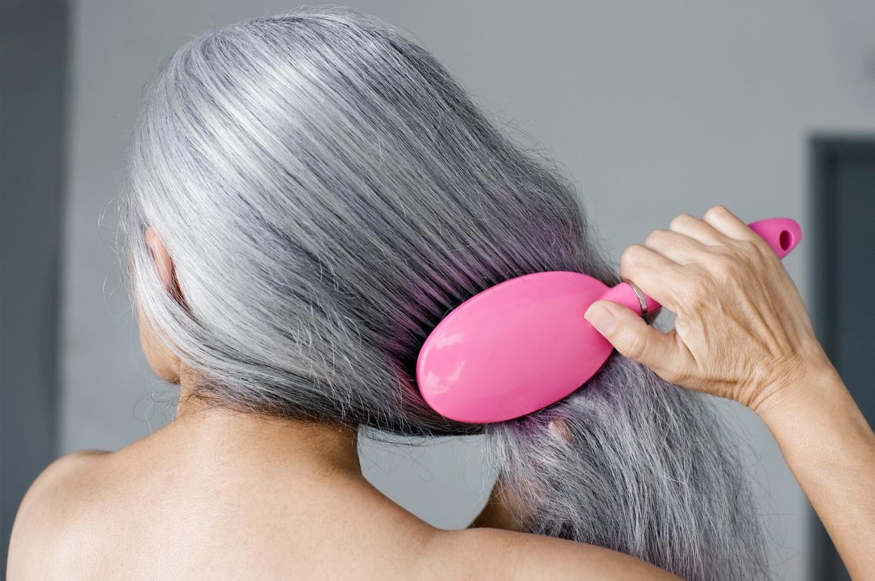 Woman brushing hair