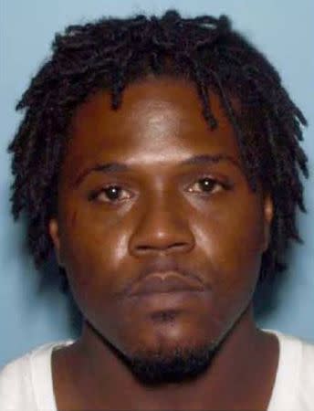 A photo of Minquell Kennedy Lembrick is seen on a poster distributed by the Georgia Bureau of Investigation December 8, 2016 asking the public for assistance in connection with the shooting of two police officers in Americus, Georgia. Georgia Burea of Investigation/Handout via Reuters