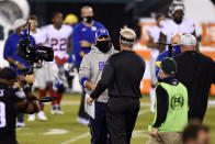 New York Giants head coach Joe Judge, left, and Philadelphia Eagles head coach Doug Pederson meet after an NFL football game, Thursday, Oct. 22, 2020, in Philadelphia. (AP Photo/Derik Hamilton)