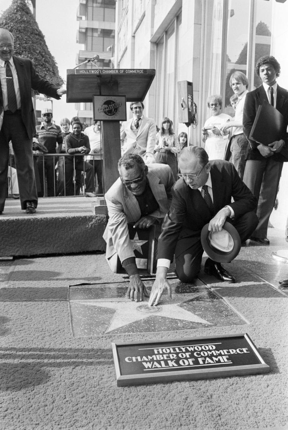 1981: Ray Charles touches his name on his Hollywood star
