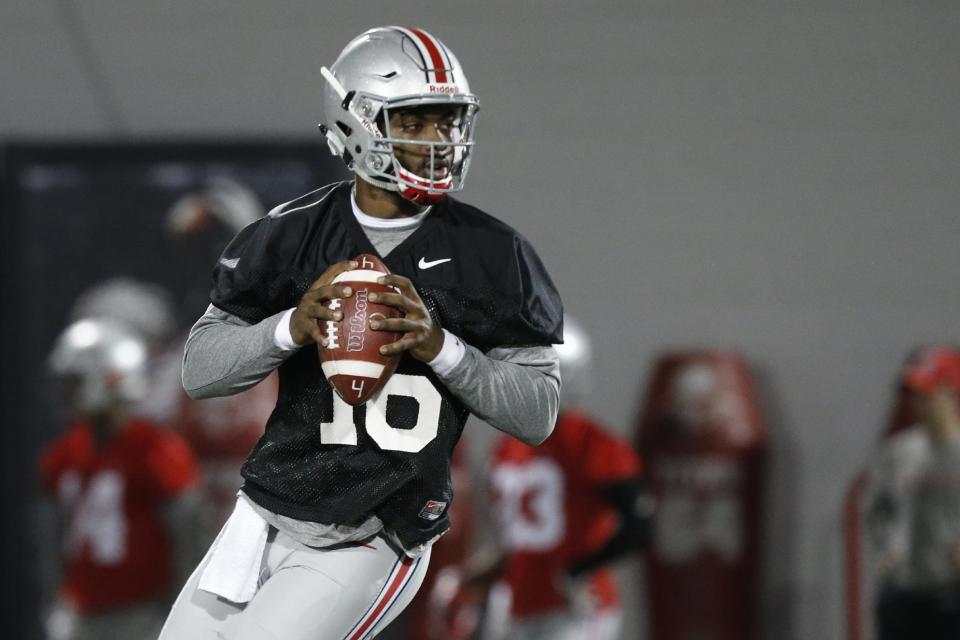 Ohio State quarterback J.T. Barrett drops back to pass during spring NCAA college football practice Tuesday, March 7, 2017, in Columbus, Ohio. (AP Photo/Jay LaPrete)