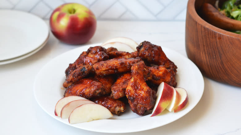 Plate piled with glazed chicken wings