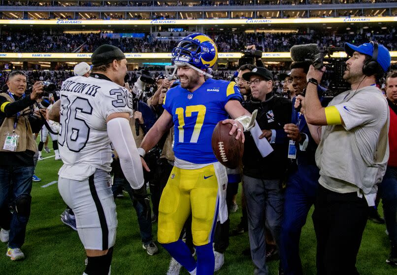 INGLEWOOD, CA - DECEMBER 8, 2022: Rams quarterback Baker Mayfield is congratulated.