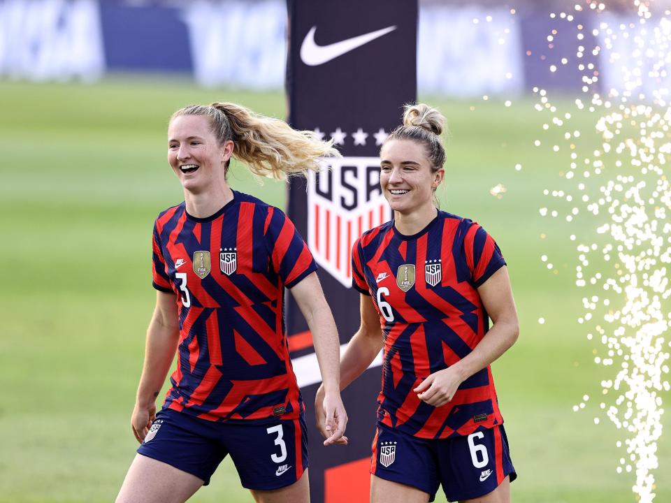 Samantha and Kristie Mewis on a soccer field