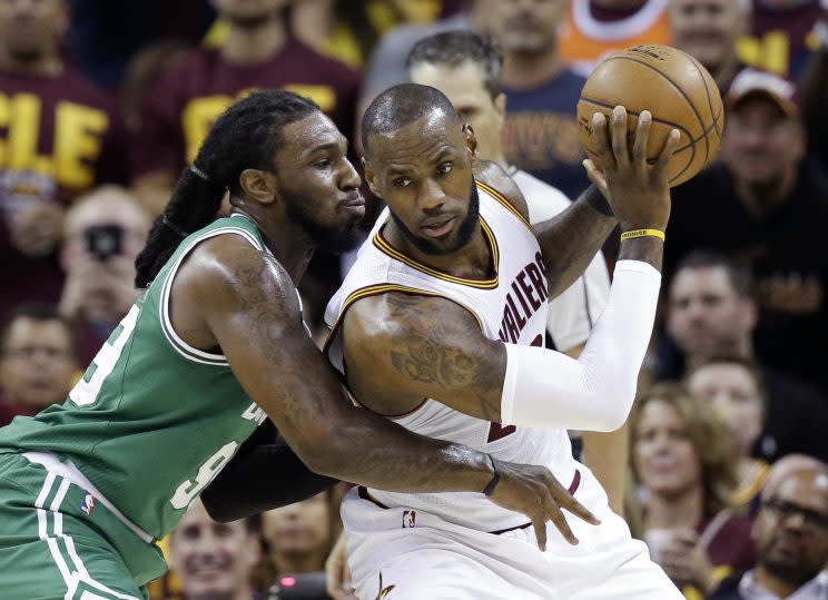 Cleveland Cavaliers’ LeBron James, right, backs down Boston Celtics’ Jae Crowder (99) during the first half of Game 3 of the NBA basketball Eastern Conference finals, Sunday, May 21, 2017, in Cleveland. (AP Photo/Tony Dejak)