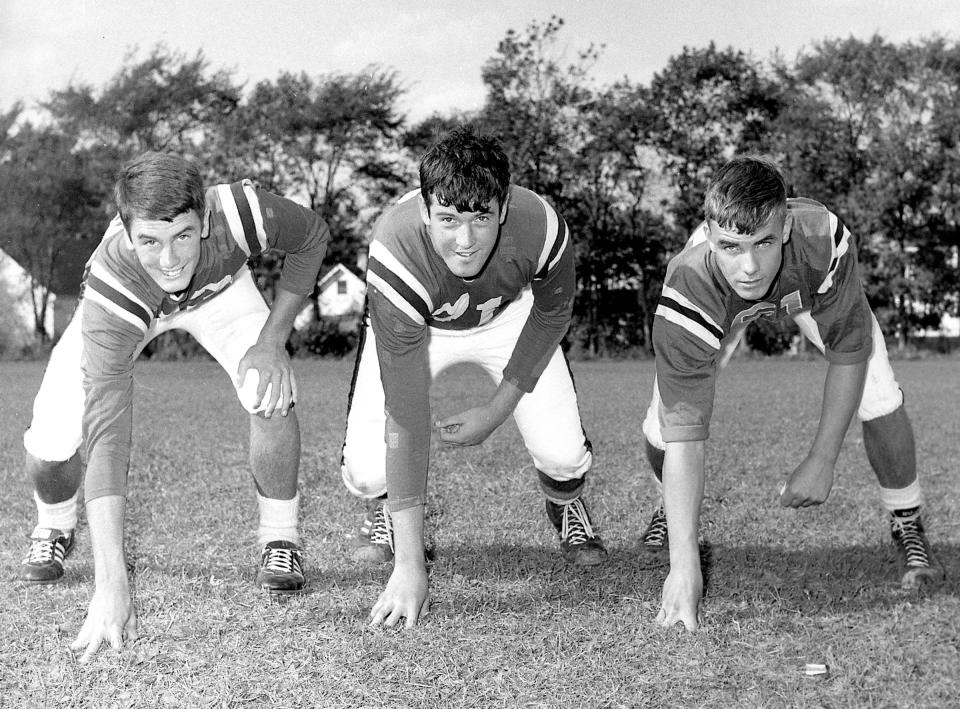 A trio of Rogers High School football players are shown in this photo from Sept. 23, 1966.