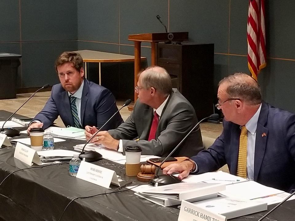 Then-State Treasurer Scott Fitzpatrick, left, defended accelerating redemptions of low-income housing tax credits during a September 2021 meeting of the Missouri Housing Development Commission while Commissioner Mark Eliff, center, and Lt. Gov. Mike Kehoe listen.