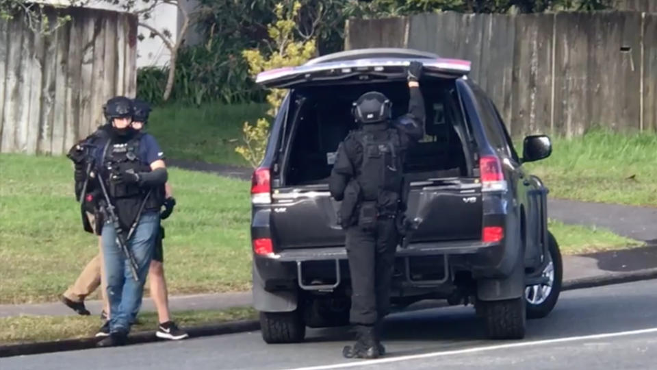 Armed police stormed a home in West Auckland today shortly before 2:30pm and arrested two men over the incident.