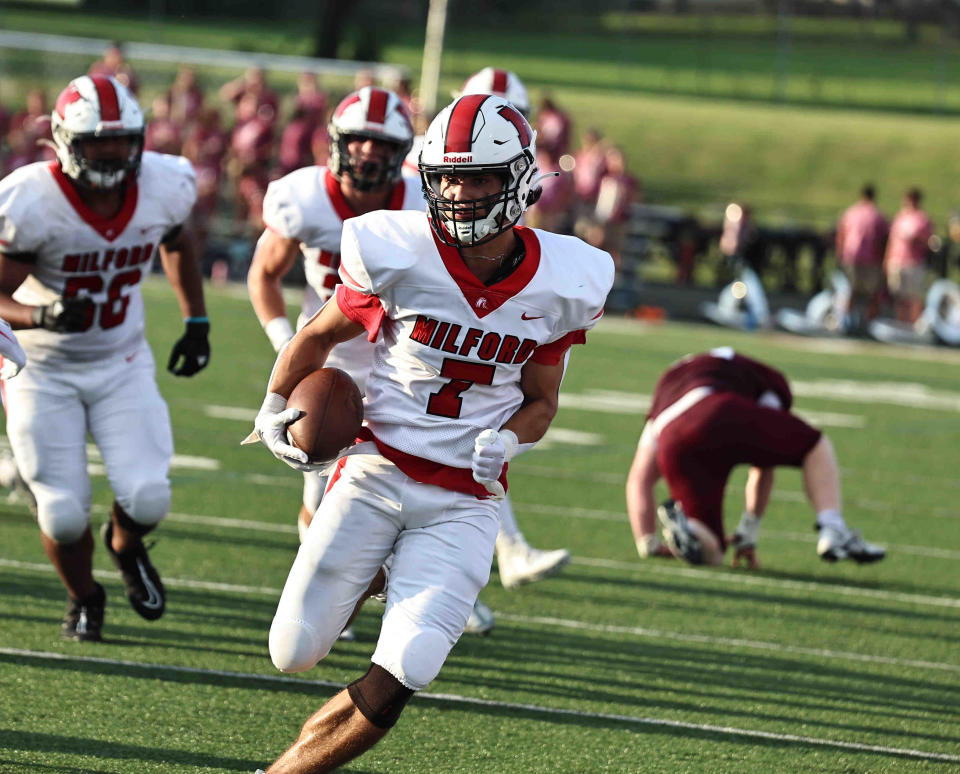 Milford wide receiver Reece Davis (7) returns a punt during their football game against Lebanon Friday, Aug. 25, 2023.