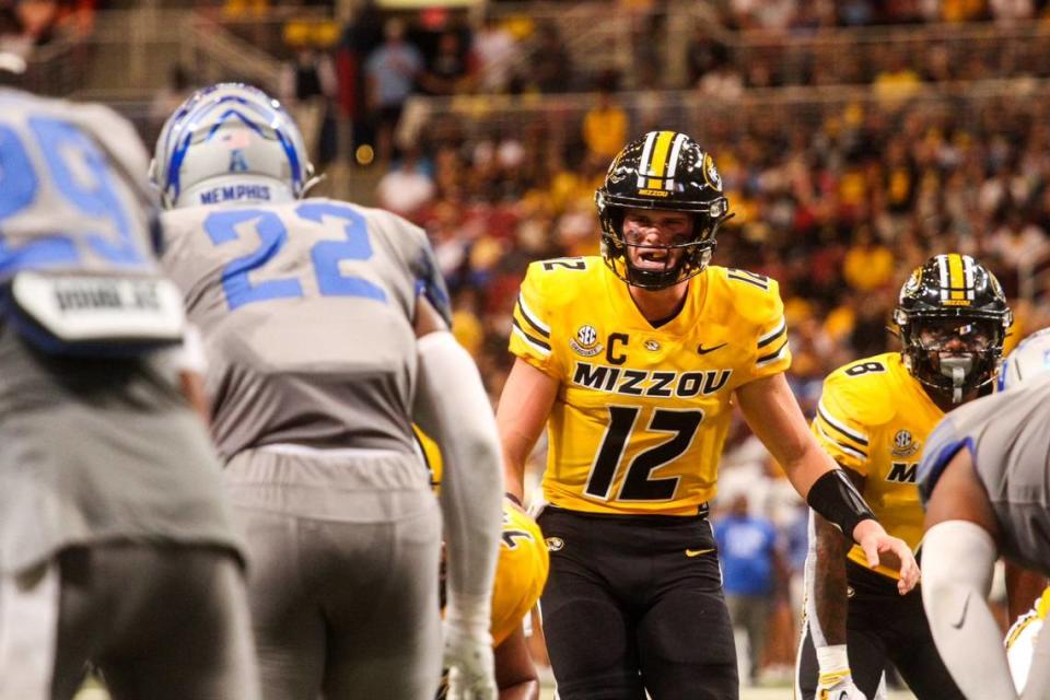 Missouri quarterback Brady Cook surveys the line of scrimmage before a play during MU’s game against Memphis at the Dome at America’s Center on Sept. 23, 2023, in St. Louis, Mo.