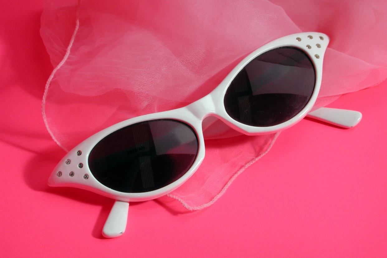 Cat eye sunglasses on pink chiffon