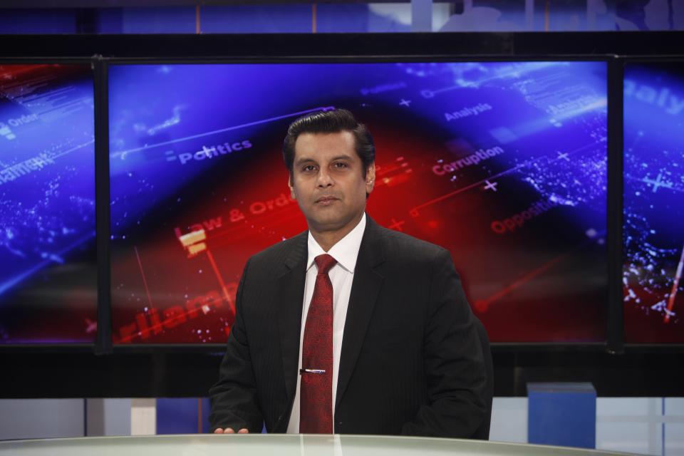 Senior Pakistani journalist Arshad Sharif poses for photograph prior to recoding an episode of his talk show at a studio, in Islamabad, Pakistan, Dec. 15, 2016. Sharif, 50, had been in hiding abroad after leaving Pakistan to avoid arrest on charges of criticizing his country's powerful military. Sharif was shot and killed by police after the car he was in sped up instead of halting at a roadblock near Nairobi, the police said Monday, Oct. 24, 2022. The police said it was a case of "mistaken identity" during a search for a similar car involved in a case of child abduction. (AP Photo)