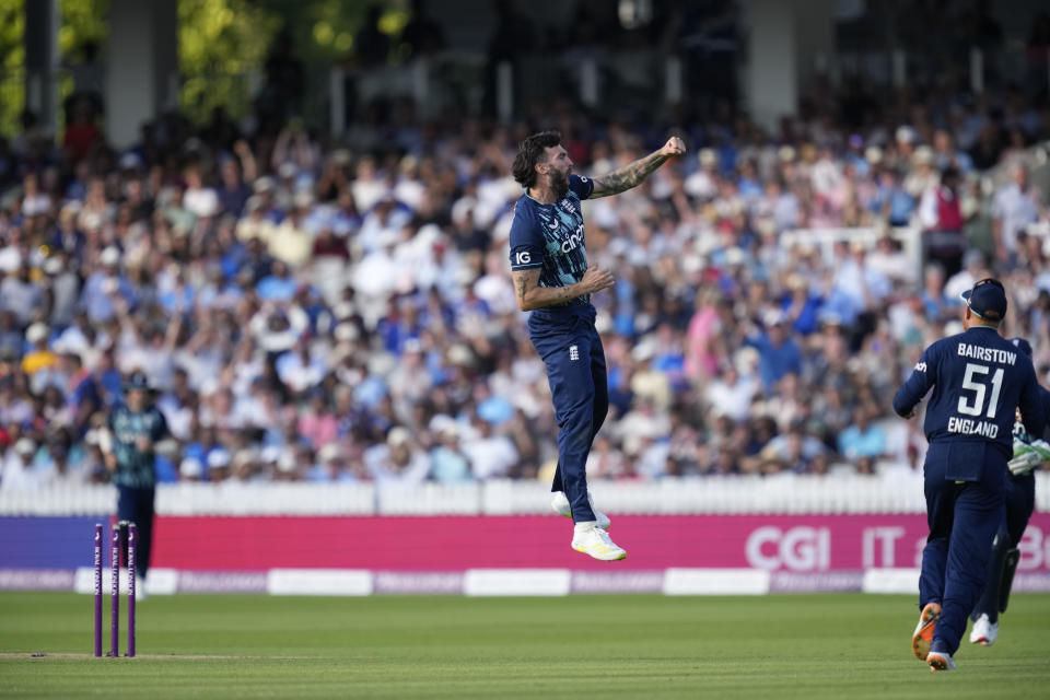 England's Reece Topley celebrates taking the wicket of India's Suryakumar Yadav during the second one day international cricket match between England and India at Lord's cricket ground in London, Thursday, July 14, 2022. (AP Photo/Matt Dunham)