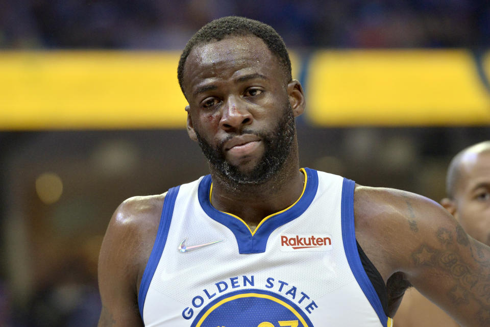 Blood is visible on the face of Golden State Warriors forward Draymond Green in the first half during Game 2 of a second-round NBA basketball playoff series against the Memphis Grizzlies Tuesday, May 3, 2022, in Memphis, Tenn. (AP Photo/Brandon Dill)