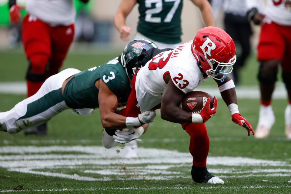 Rutgers running back Kyle Monangai, right, is tackled by Michigan State's Xavier Henderson (3) during the first half of an NCAA college football game, Saturday, Nov. 12, 2022, in East Lansing, Mich. (AP Photo/Al Goldis)