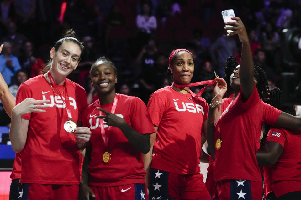 Gold medalists the United States celebrate on the podium after defeating China in the final at the women's Basketball World Cup in Sydney, Australia, Saturday, Oct. 1, 2022. (AP Photo/Mark Baker)