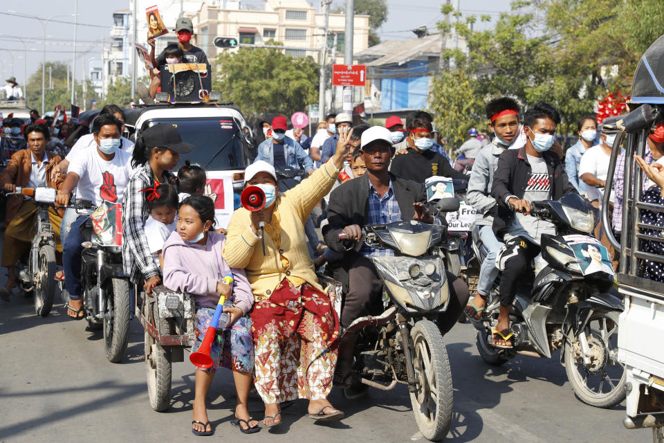 Anti-coup protesters hold a rally in Mandalay, Myanmar, Saturday, Feb. 13, 2021. Mass street demonstrations in Myanmar have entered their second week with neither protesters nor the military government they seek to unseat showing any signs of backing off from confrontations. (AP Photos)