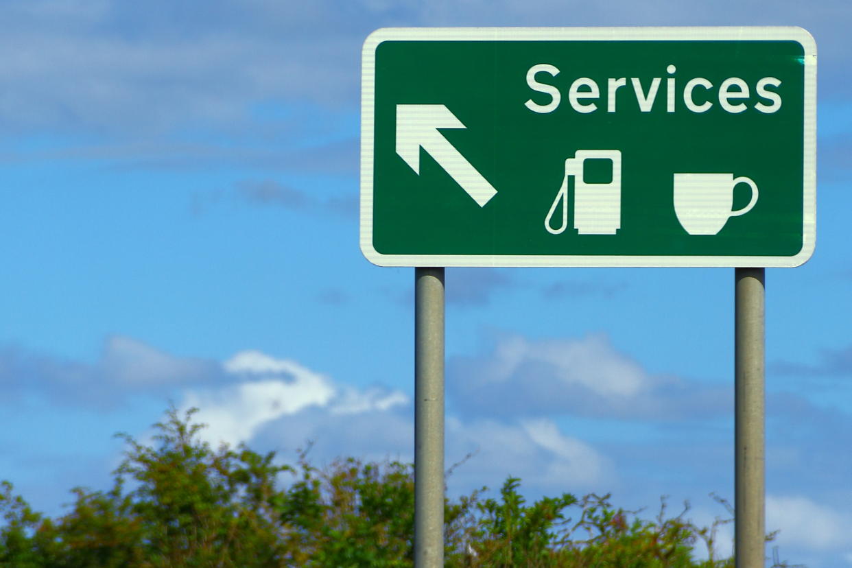 A motorway sign indicating an exit for the services. Photo: Getty
