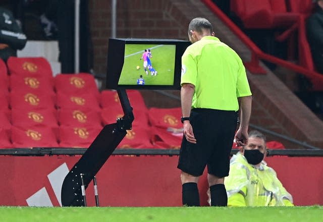 Mike Dean sent off Southampton's Jan Bednarek after consulting the VAR pitchside monitor.