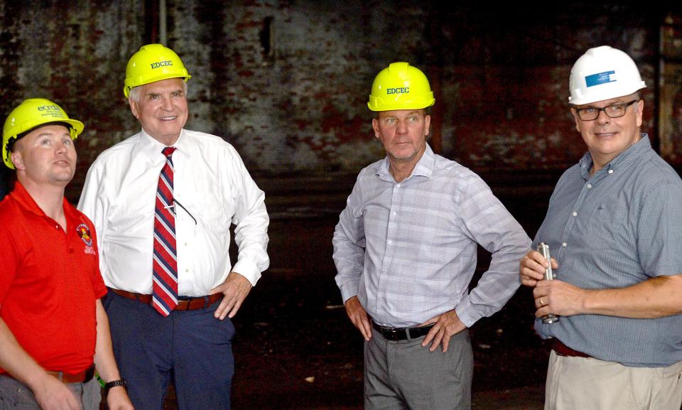 From left: Erie County Executive Brenton Davis, U.S. Rep. Mike Kelly, of Butler, R-16th Dist.; state Sen. Dan Laughlin, of Millcreek, R-49th Dist., and Dave Brennan, architect with Bostwick Design Partnership of Erie are shown, on Aug. 29, 2022, at the former Erie Malleable Iron Co. manufacturing site at Cherry and West 12th streets in Erie. The Erie County Redevelopment Authority, which purchased the five-acre site, plans to begin demolition on a portion of the site in about a month. Plans call for rehabilitating some of the buildings, demolishing others and eventually building new buildings for office space and light manufacturing.