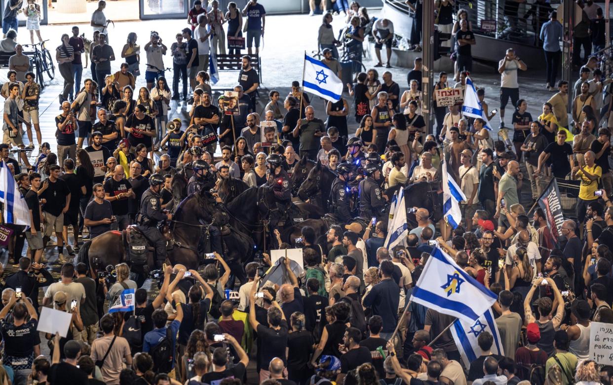 Thousands of Israelis gather around Israeli Prime Minister Benjamin Netanyahu's residence with banners to protest against him and his government for not signing the ceasefire agreement