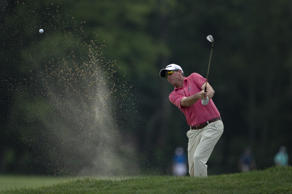 Jim Herman hits the ball from a bunker on the 18th hole during the second round of the Barbasol Championship golf tournament at Keene Trace Golf Club in Nicholasville, Ky., Friday, July 19, 2019. (Ryan C. Hermens/Lexington Herald-Leader via AP)