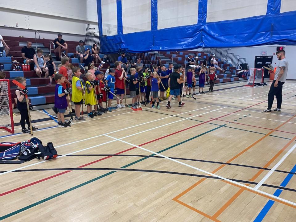 A group of kids before the ParticipACTION Community Challenge Youth Ball Hockey Tournament held last June.