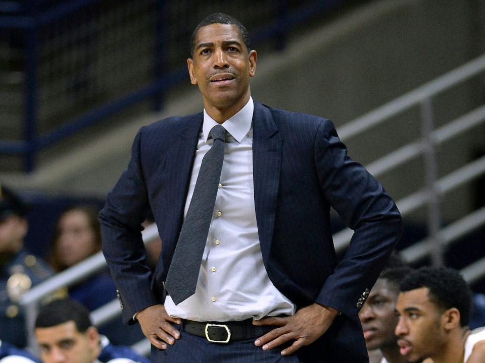 Kevin Ollie looks up from the sidelines during a college game in 2018.