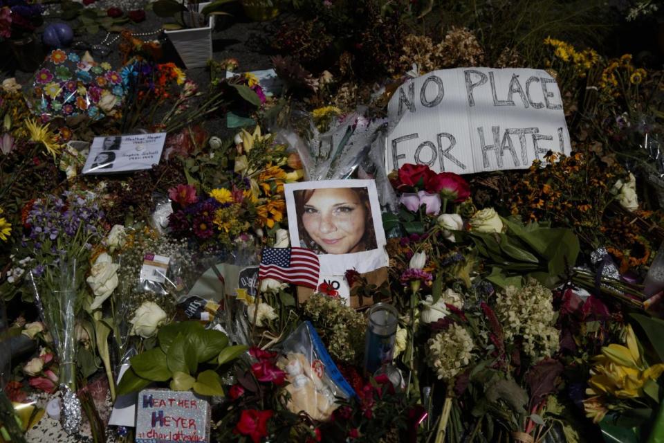 A photo of Heather Heyer among flowers at a vigil for her (AP)