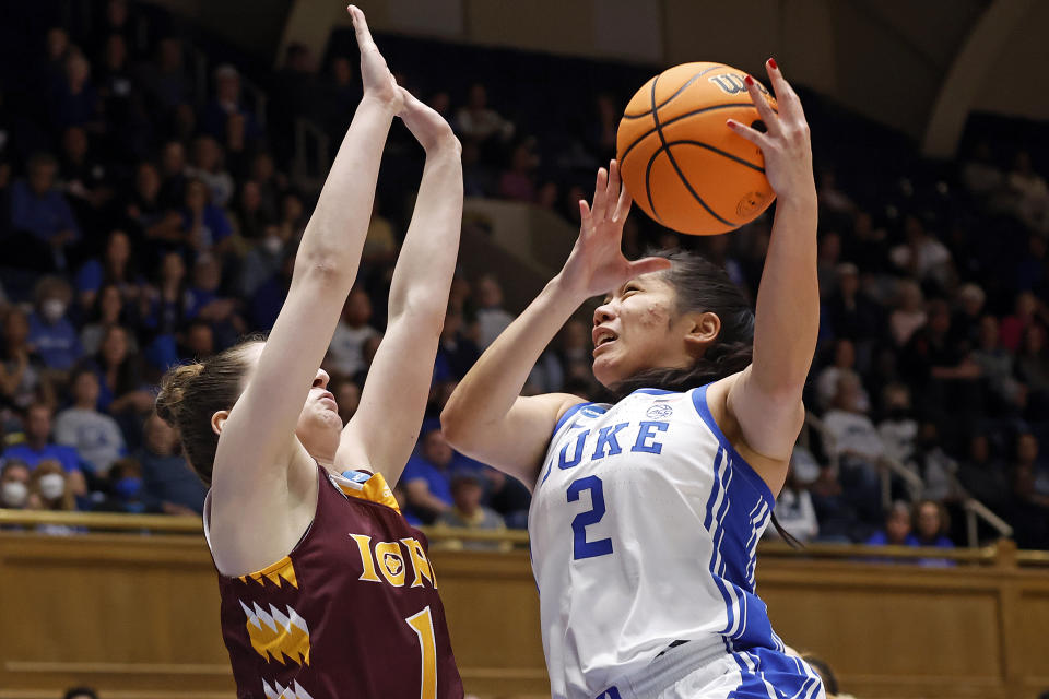 Duke's Vanessa de Jesus (2) tries to drive the ball past Iona's Natalia Otkhmezuri (1) during the first half of a first-round college basketball game of the NCAA Tournament, Saturday, March 18, 2023, in Durham, N.C. (AP Photo/Karl B. DeBlaker)