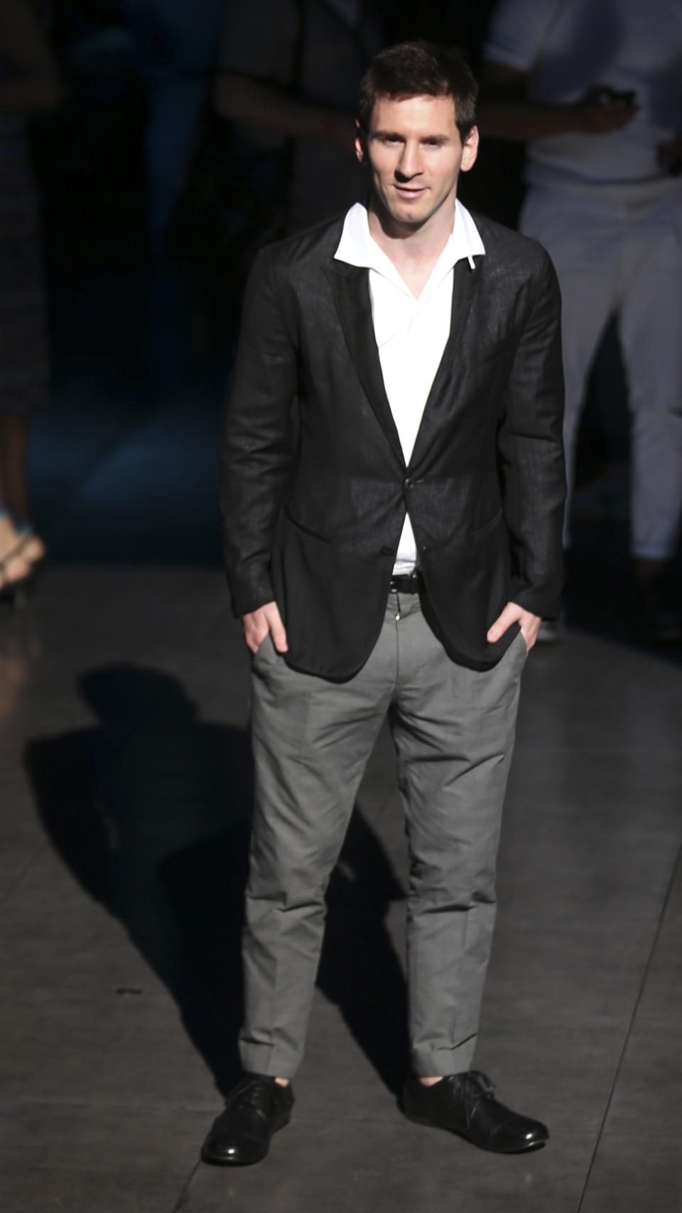 Argentine soccer star Lionel Messi poses in front of photographers prior to the start of the Dolce & Gabbana men's Spring-Summer 2014-15 collection show, part of the Milan Fashion Week, unveiled in Milan, Italy, Saturday, June 22, 2013. (AP Photo/Luca Bruno)