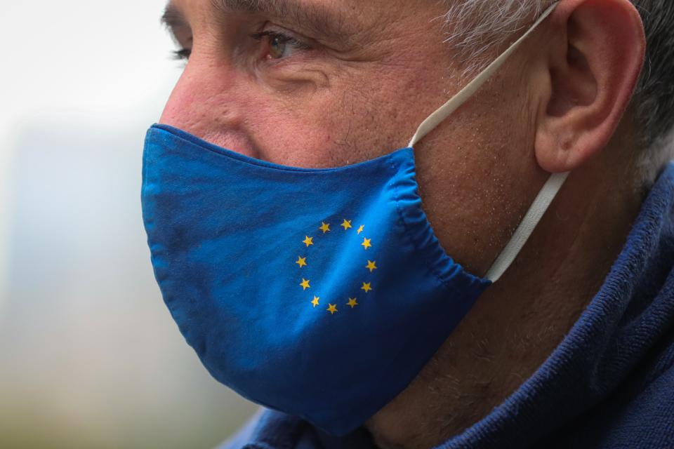 A man wears a face mask with the European Union flag in Brussels, Belgium. Photo: Xinhua/Zheng Huansong via Getty Images