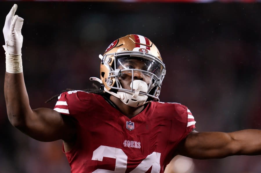 San Francisco 49ers running back Jordan Mason (24) hypes up the crowd on a kick return during an NFL football game against the Green Bay Packers Sunday, Jan. 21, 2024, in Inglewood, Calif. (AP Photo/Ashley Landis)