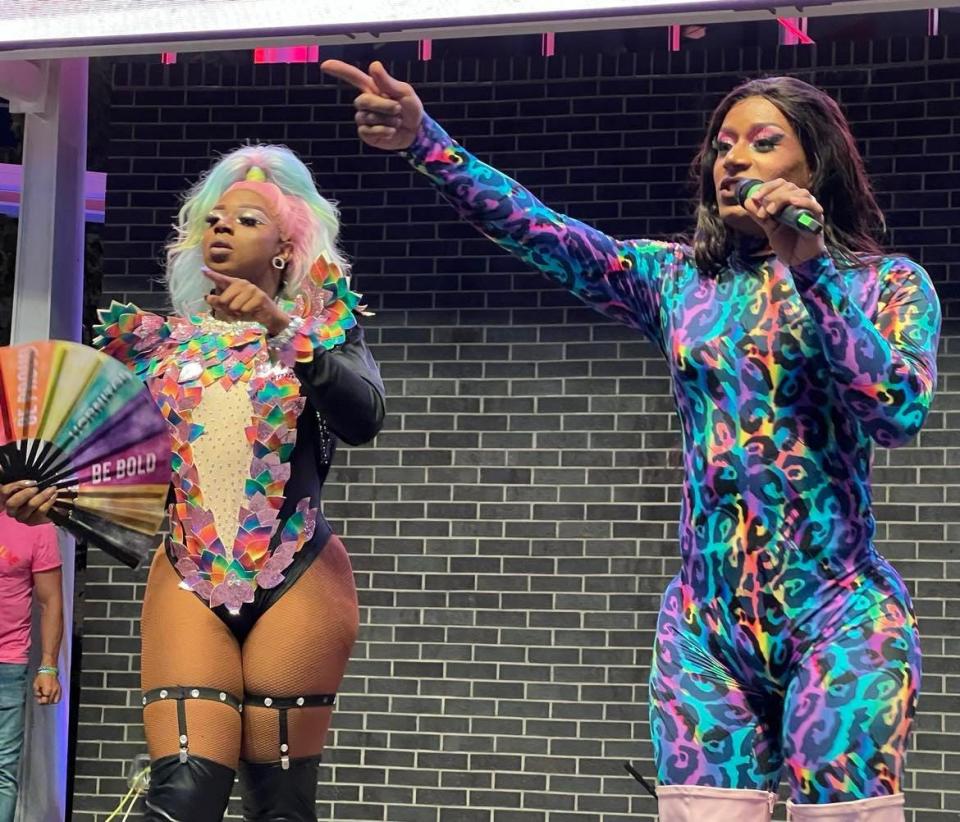 Drag queen Kardi Redd Diamond, right, is on stage during the Stark Pride Festival. The Canton resident is a well-known drag artist in Northeast Ohio.