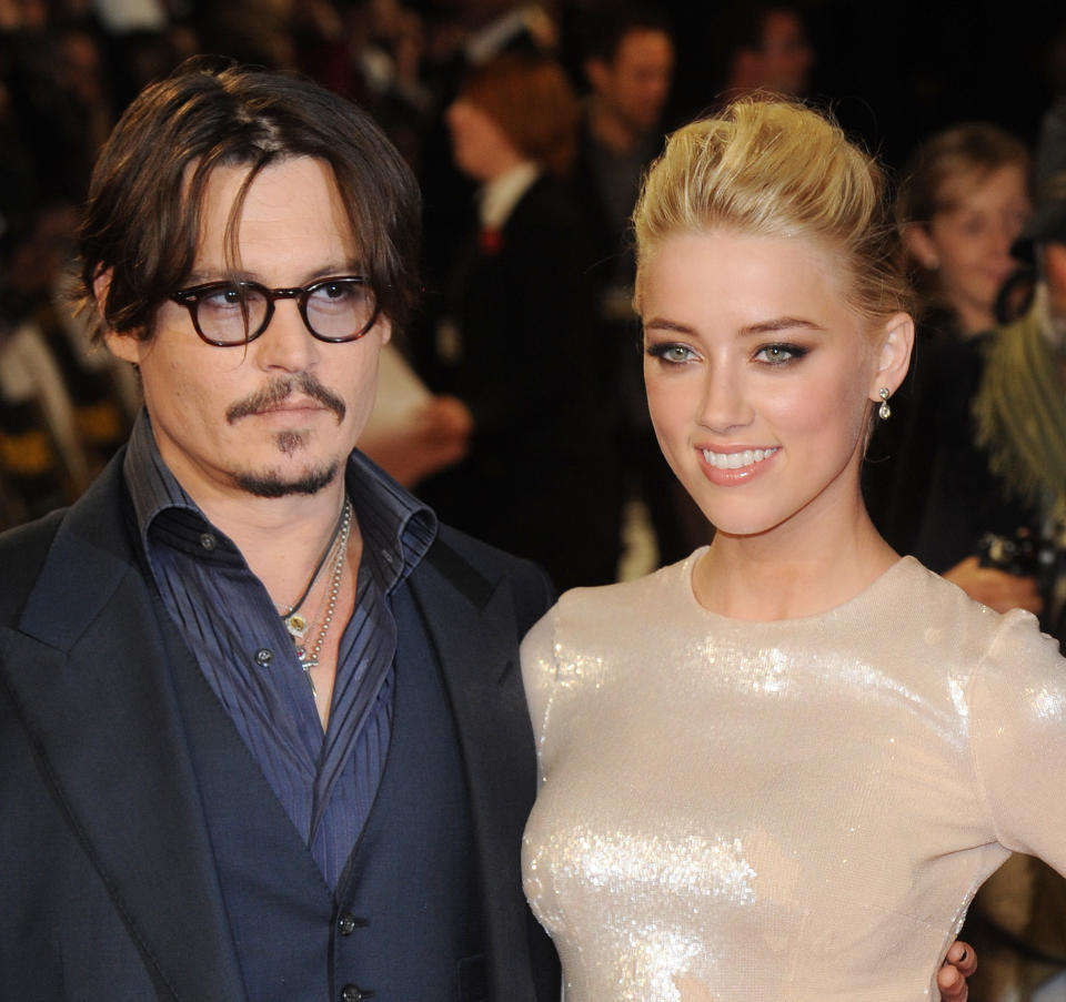 Johnny Depp and Amber Heard attend the premiere of "Rum Diary" at Odeon, Kensington. (Photo by Rune Hellestad/Corbis via Getty Images)