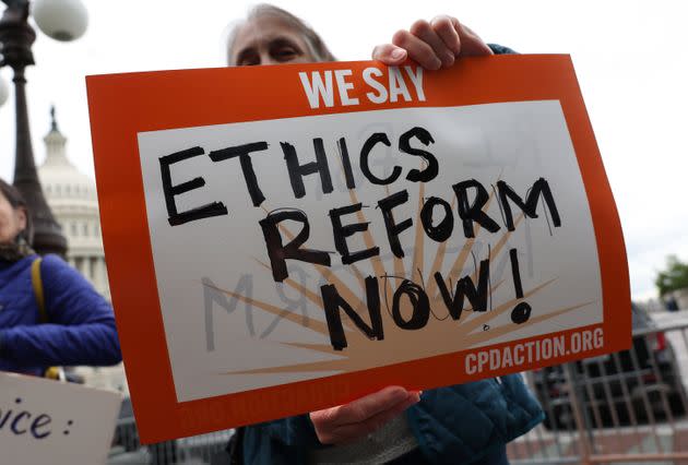 Activists attend a press conference on Supreme Court ethics reform outside of the U.S. Capitol on Tuesday in Washington, D.C. A group of Democratic Senators are calling on legislation for a judicial ethics code that would govern all federal judges, including the nine Supreme Court Justices.