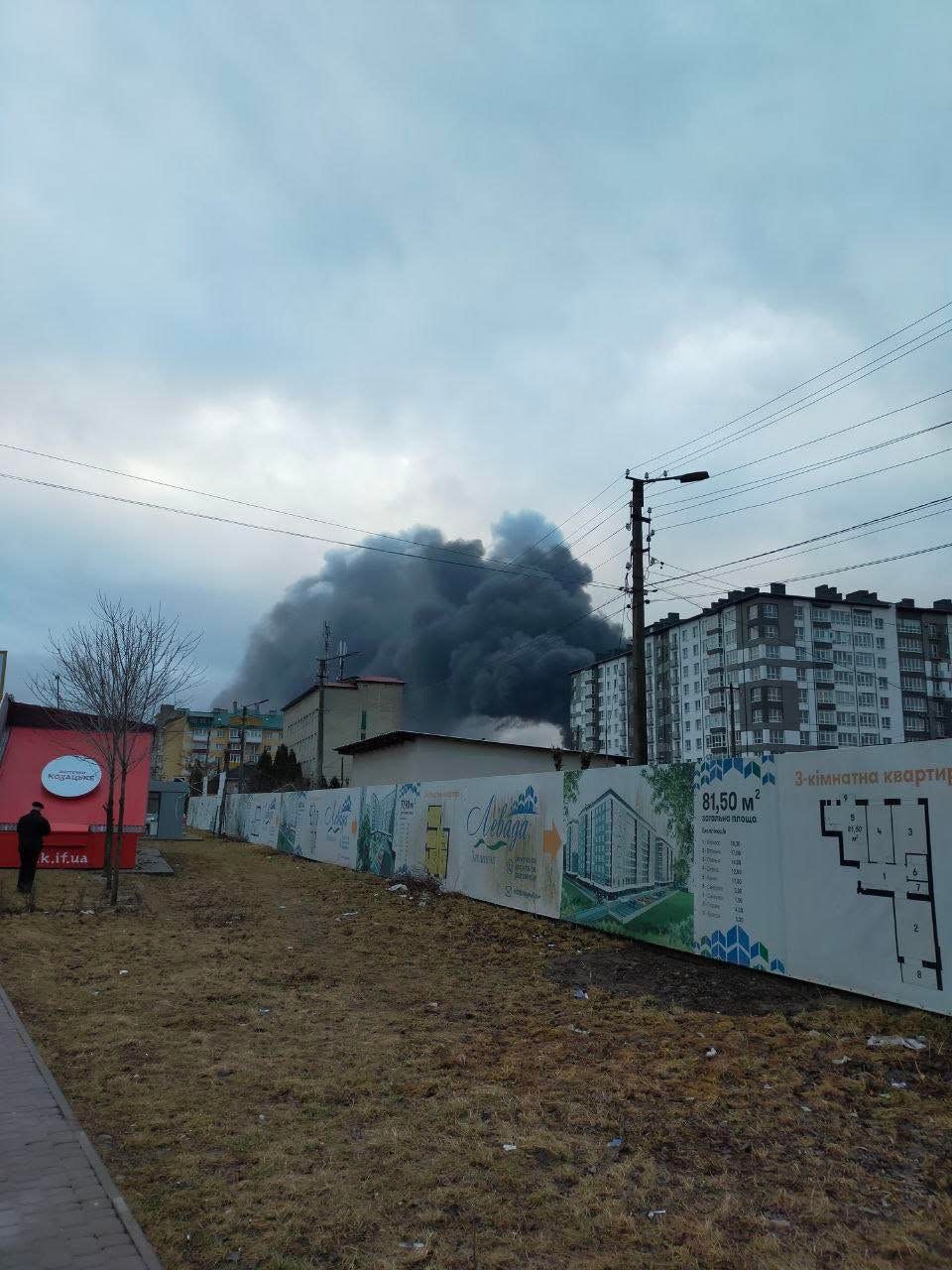 Black smoke rises from explosions in a Ukrainian neighborhood as the Russians attack.